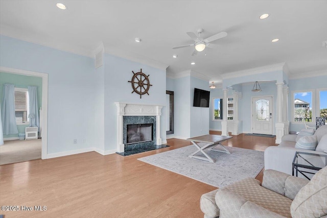 3720 Island Dr, North Topsail Beach, NC 28460 - living area with crown molding, a ceiling fan, ornate columns, and wood finished floors