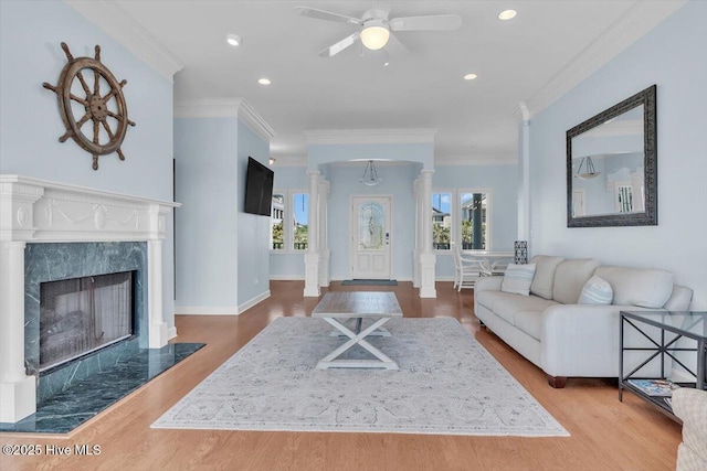 3720 Island Dr, North Topsail Beach, NC 28460 - living area featuring crown molding, a ceiling fan, recessed lighting, decorative columns, and wood finished floors