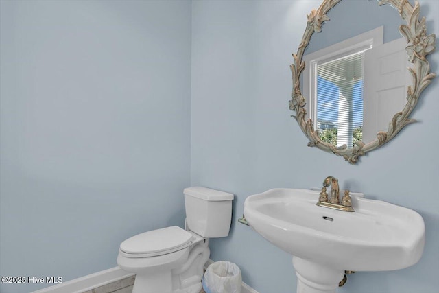 3720 Island Dr, North Topsail Beach, NC 28460 - half bath featuring baseboards, a sink, and toilet