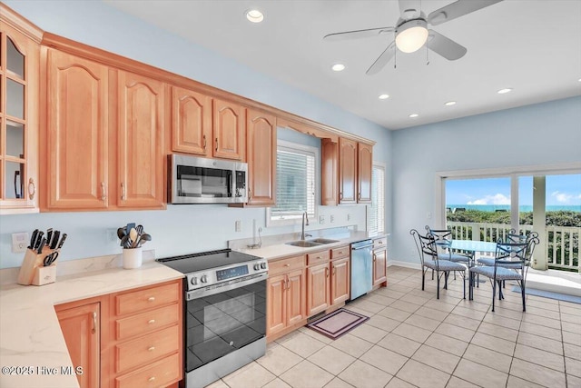 3720 Island Dr, North Topsail Beach, NC 28460 - kitchen featuring ceiling fan, a sink, stainless steel appliances, recessed lighting, and glass insert cabinets