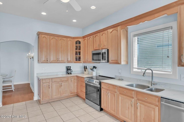 3720 Island Dr, North Topsail Beach, NC 28460 - kitchen with light brown cabinetry, ceiling fan, appliances with stainless steel finishes, a sink, and light countertops