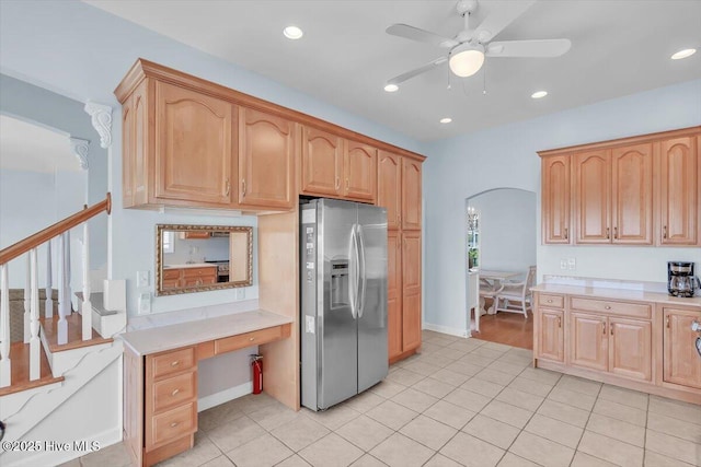 3720 Island Dr, North Topsail Beach, NC 28460 - kitchen with ceiling fan, recessed lighting, light countertops, stainless steel fridge with ice dispenser, and arched walkways