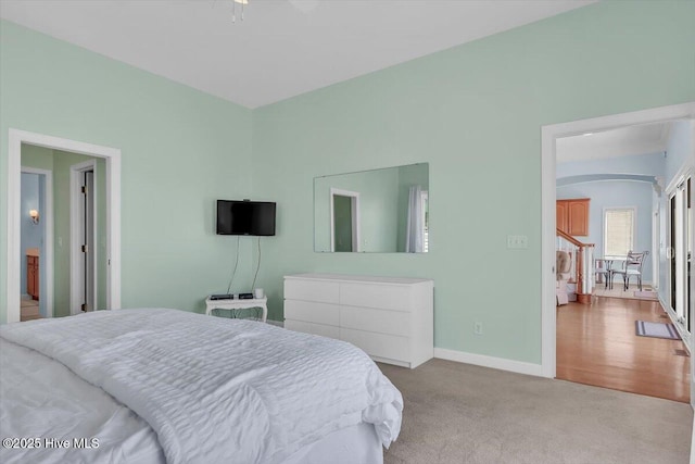 3720 Island Dr, North Topsail Beach, NC 28460 - carpeted bedroom with baseboards and arched walkways
