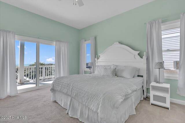 3720 Island Dr, North Topsail Beach, NC 28460 - bedroom with access to outside, ceiling fan, and light carpet