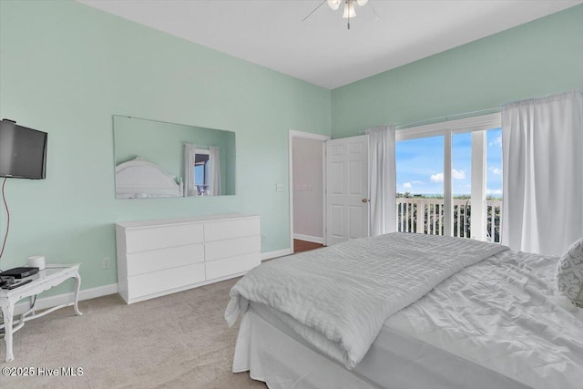 3720 Island Dr, North Topsail Beach, NC 28460 - carpeted bedroom with access to outside, baseboards, and ceiling fan