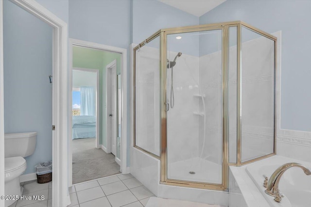 3720 Island Dr, North Topsail Beach, NC 28460 - bathroom featuring tile patterned flooring, toilet, a shower stall, vaulted ceiling, and a bath