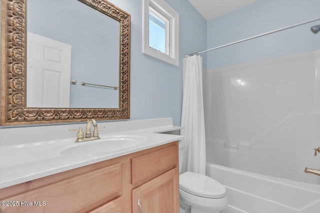 3720 Island Dr, North Topsail Beach, NC 28460 - full bathroom featuring vanity, shower / bathtub combination with curtain, and toilet