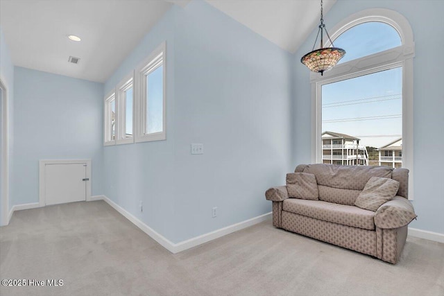 3720 Island Dr, North Topsail Beach, NC 28460 - sitting room featuring baseboards, visible vents, lofted ceiling, and light colored carpet