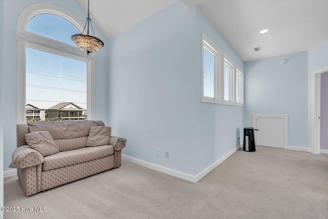 3720 Island Dr, North Topsail Beach, NC 28460 - living area with baseboards, carpet flooring, lofted ceiling, and visible vents