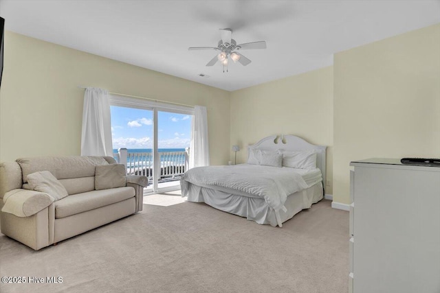 3720 Island Dr, North Topsail Beach, NC 28460 - bedroom with light colored carpet, access to exterior, a ceiling fan, a water view, and visible vents