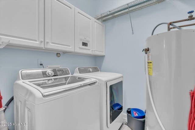 3720 Island Dr, North Topsail Beach, NC 28460 - laundry area featuring cabinet space, washer and clothes dryer, and water heater