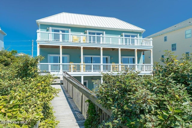 3720 Island Dr, North Topsail Beach, NC 28460 - back of property featuring a standing seam roof and metal roof