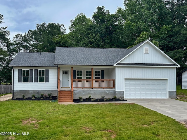 229 Spring Dr, Jacksonville, NC 28540 - view of front of house featuring a porch, a garage, concrete driveway, and roof with shingles