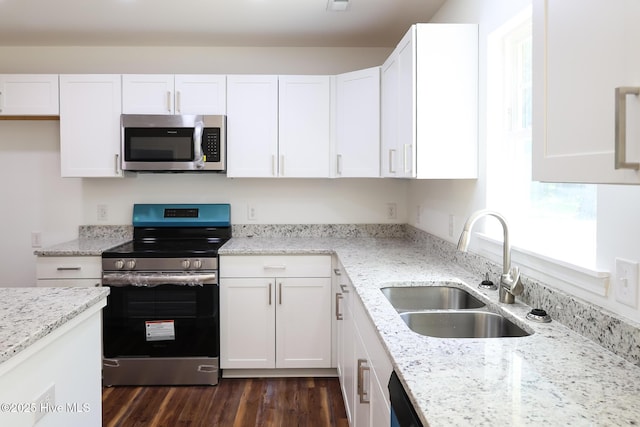 229 Spring Dr, Jacksonville, NC 28540 - kitchen with stainless steel appliances, a sink, and white cabinetry