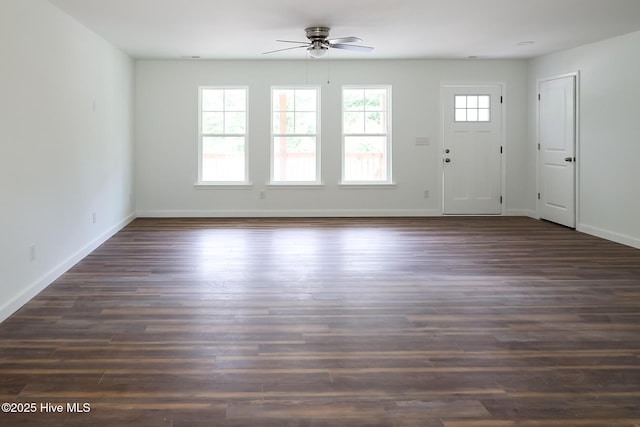 229 Spring Dr, Jacksonville, NC 28540 - unfurnished living room with ceiling fan, baseboards, and dark wood-style floors