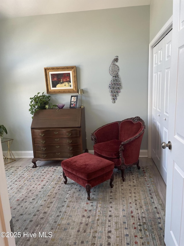 living area featuring baseboards