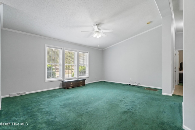 unfurnished room featuring carpet floors, ornamental molding, baseboards, visible vents, and a ceiling fan
