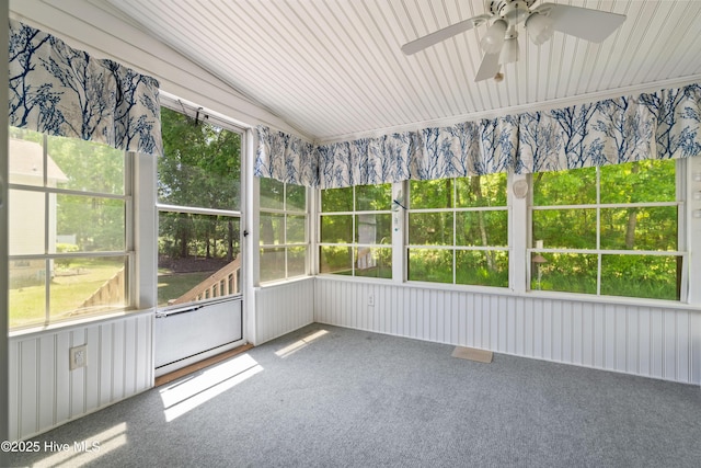 unfurnished sunroom featuring a ceiling fan