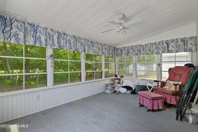 sunroom / solarium with a ceiling fan