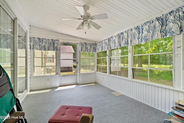 unfurnished sunroom with a ceiling fan