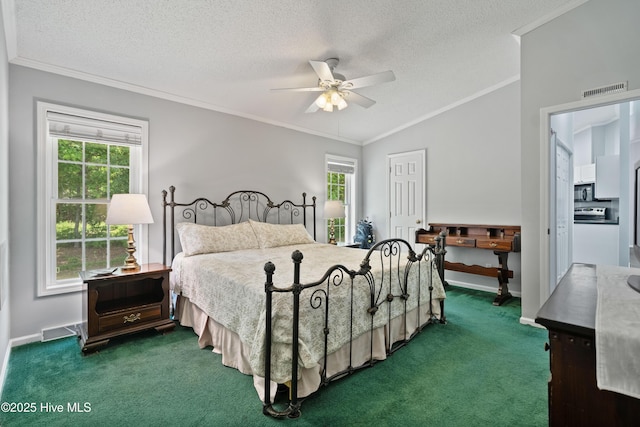 carpeted bedroom featuring a textured ceiling, crown molding, and vaulted ceiling