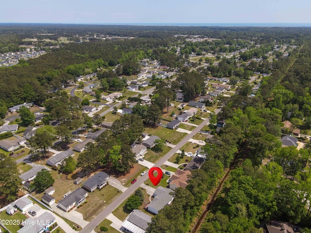 bird's eye view with a view of trees and a residential view