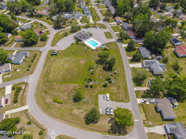 birds eye view of property with a residential view