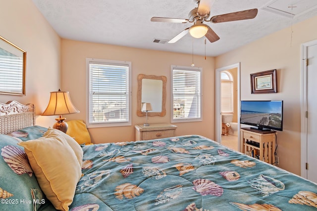 48 Wilmington St, Ocean Isle Beach, NC 28469 - bedroom with attic access, multiple windows, and a ceiling fan