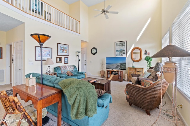 48 Wilmington St, Ocean Isle Beach, NC 28469 - carpeted living area featuring a high ceiling and ceiling fan