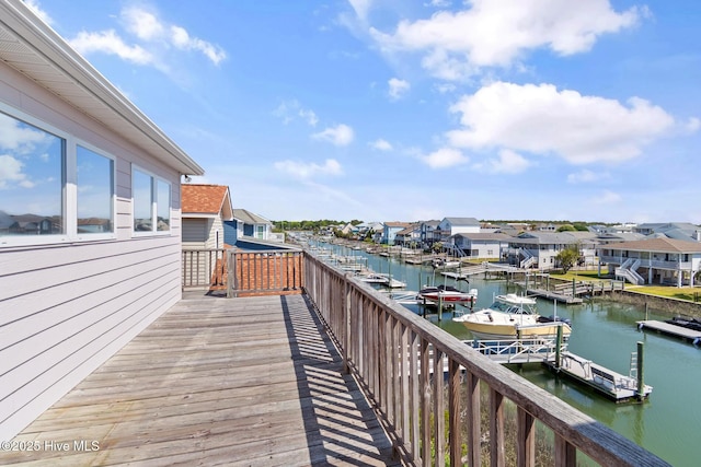 48 Wilmington St, Ocean Isle Beach, NC 28469 - wooden deck with a water view, a floating dock, and a residential view