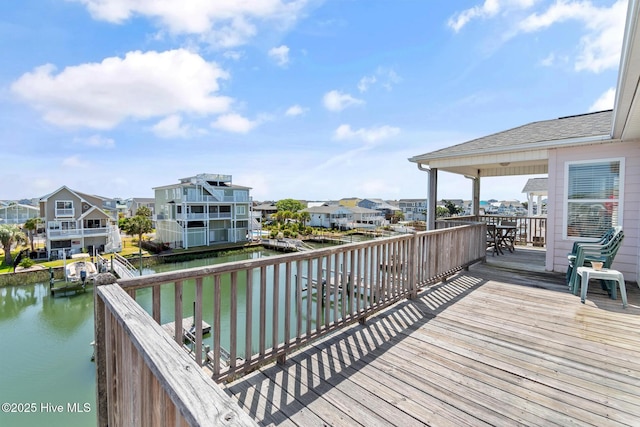 48 Wilmington St, Ocean Isle Beach, NC 28469 - deck featuring a water view and a residential view