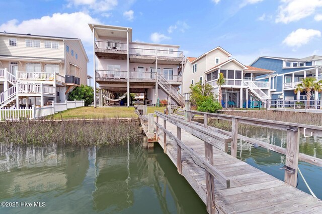 48 Wilmington St, Ocean Isle Beach, NC 28469 - dock area featuring a water view and stairs