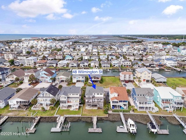 48 Wilmington St, Ocean Isle Beach, NC 28469 - aerial perspective of suburban area with a large body of water