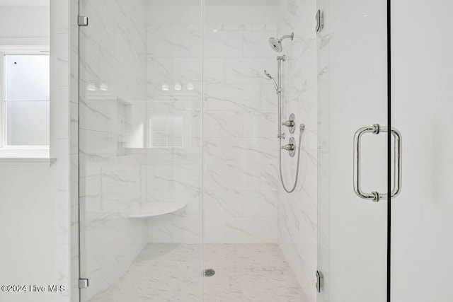 full bathroom with a marble finish shower