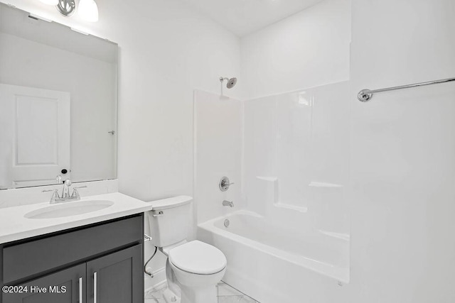 full bathroom featuring toilet, shower / tub combination, marble finish floor, and vanity