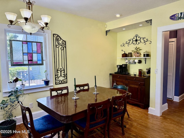 dining room with baseboards, recessed lighting, and wood finished floors