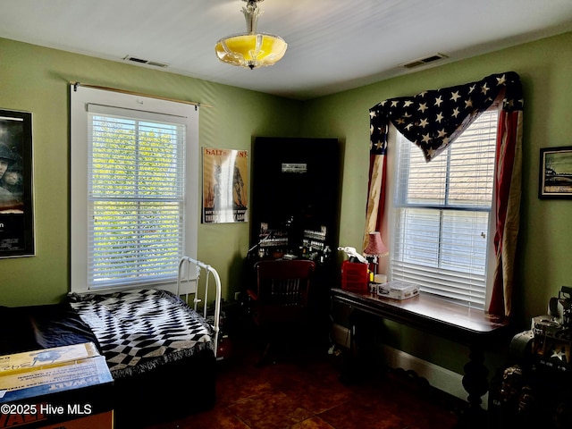 bedroom with visible vents and tile patterned flooring