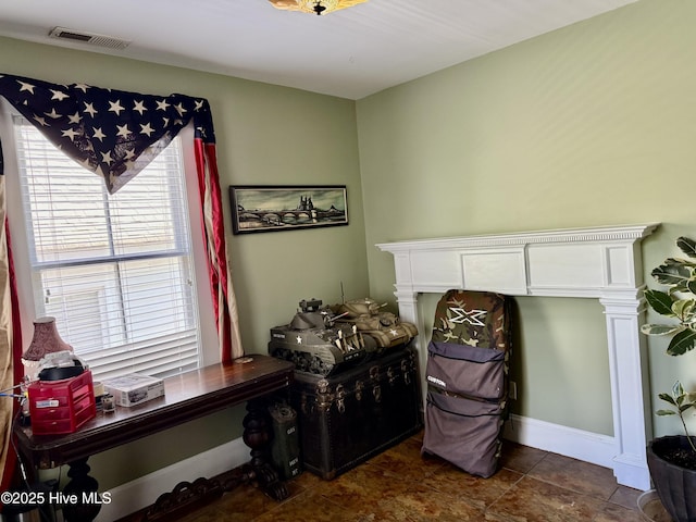 interior space with visible vents and baseboards