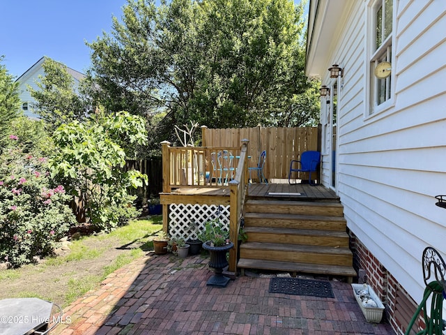 exterior space with fence and a deck