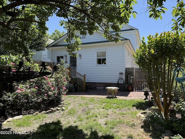 back of property with fence