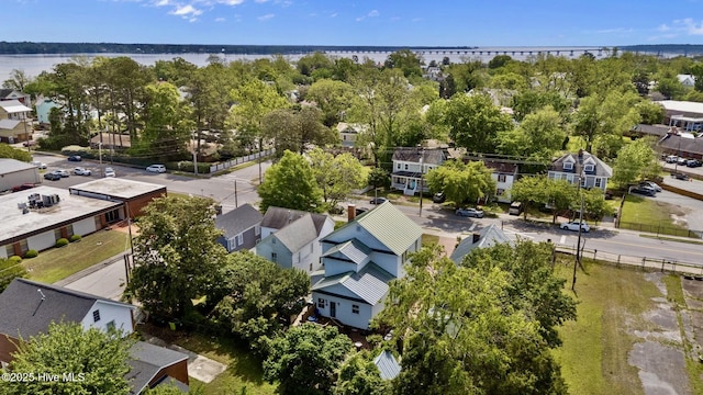 birds eye view of property with a residential view and a water view
