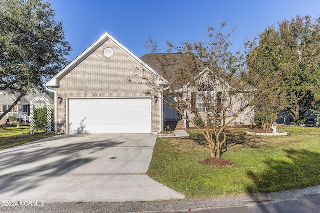 view of front of home featuring concrete driveway, brick siding, a front lawn, and a garage