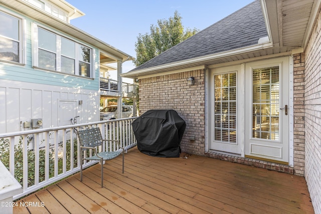 wooden deck featuring grilling area