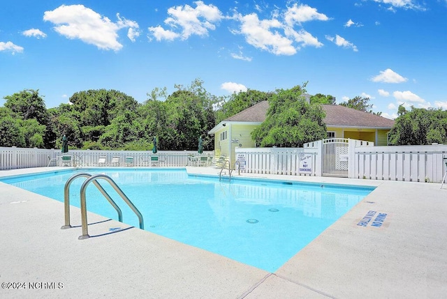 community pool featuring fence