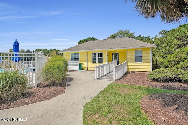 bungalow-style home featuring fence