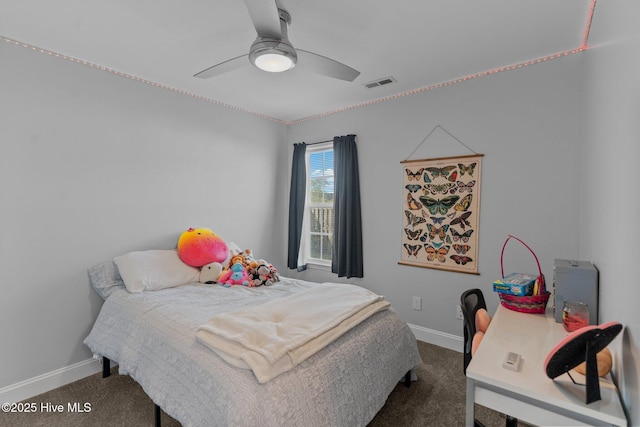 carpeted bedroom featuring baseboards, visible vents, and ceiling fan