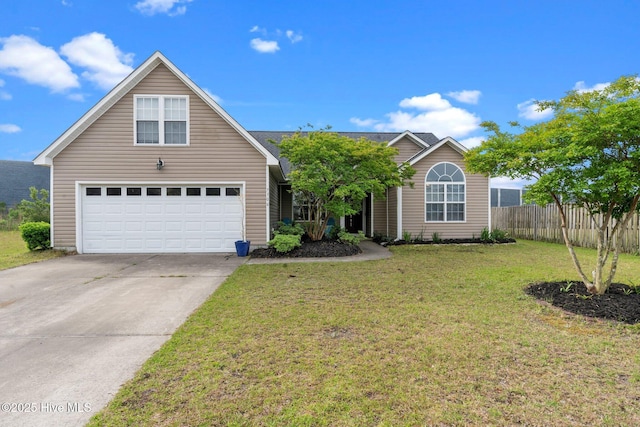 view of front of property with fence, a garage, driveway, and a front yard
