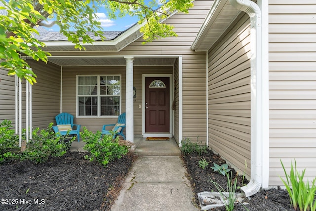 doorway to property with a porch