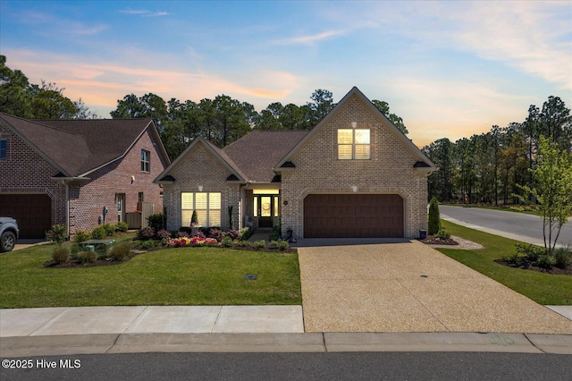 419 Glenn Ellen Dr, Wilmington, NC 28412 - traditional home featuring brick siding, a garage, a lawn, and concrete driveway