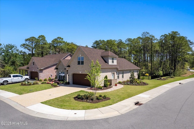 419 Glenn Ellen Dr, Wilmington, NC 28412 - view of front facade featuring an attached garage, driveway, brick siding, and a front yard